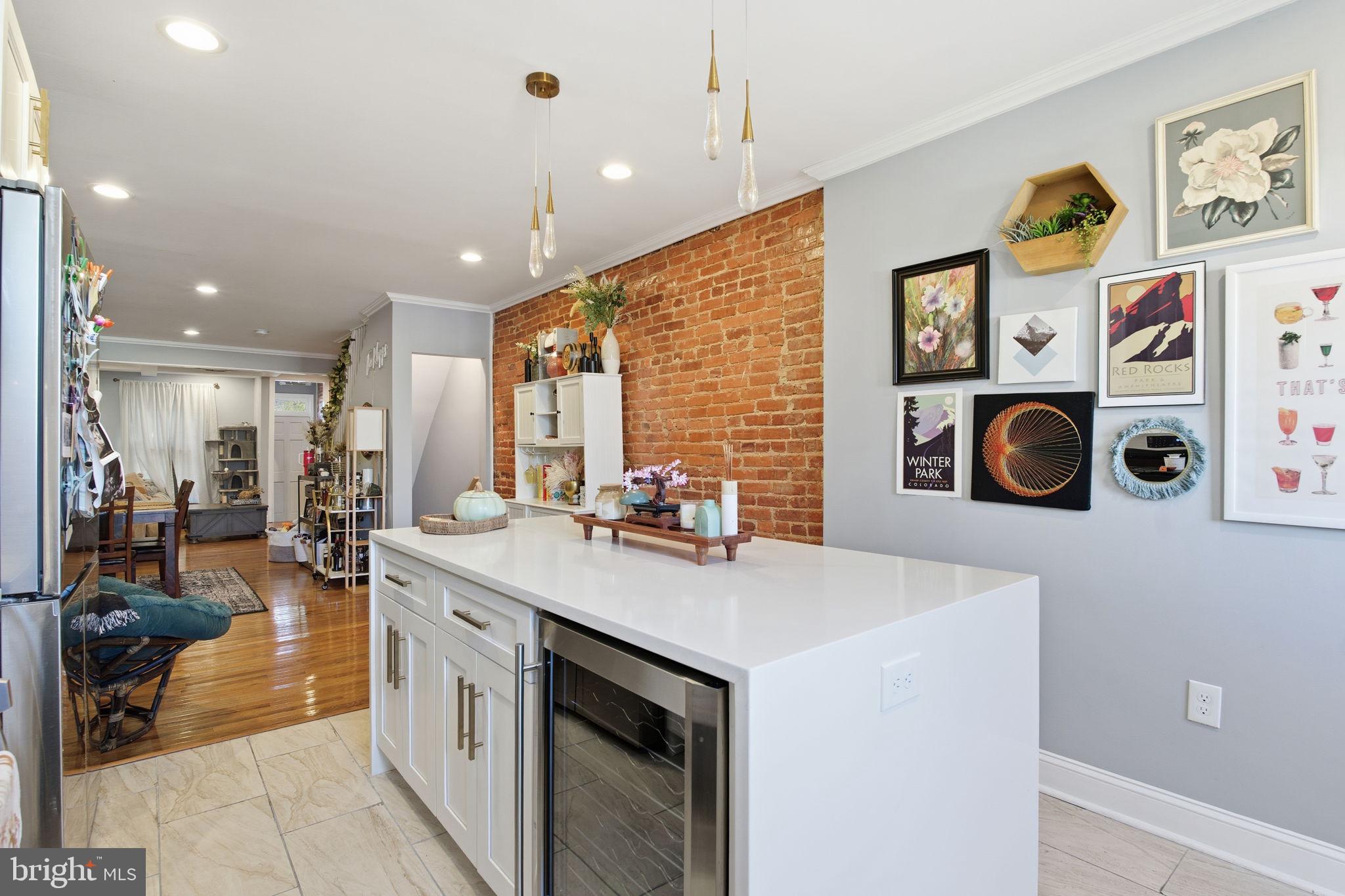 236 South Clinton Street Baltimore, MD 21224 - Photo 8 of 34 a view of a kitchen with stainless steel appliances granite countertop a stove and a sink