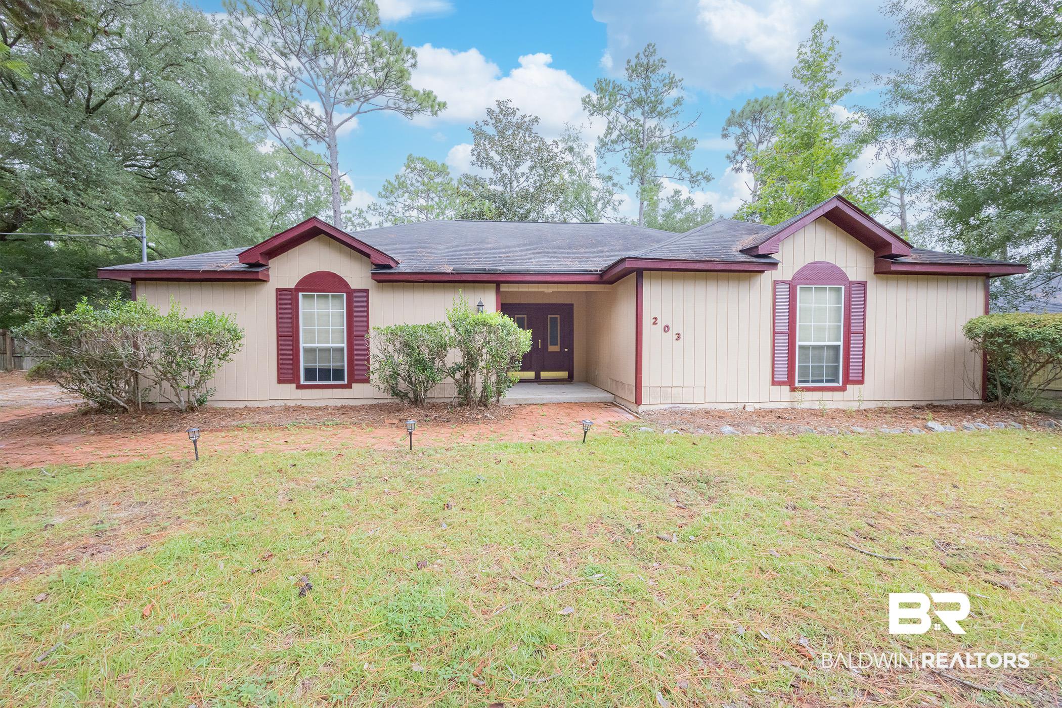 203 Montclair Loop Daphne, AL 36526 - Photo 1 of 30 View of front facade with a front lawn and a shingled roof