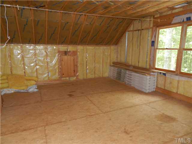 8912 Charlottes Mountain Road Rougemont, NC 27572 - Photo 18 of 25 a view of an empty room with a window