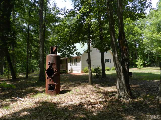 8912 Charlottes Mountain Road Rougemont, NC 27572 - Photo 3 of 25 a view of a house with backyard and a tree