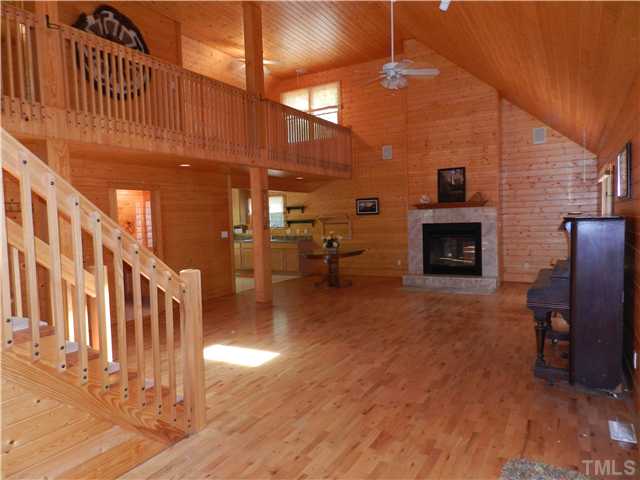 8912 Charlottes Mountain Road Rougemont, NC 27572 - Photo 4 of 25 a living room with furniture or fireplace and a wooden floor