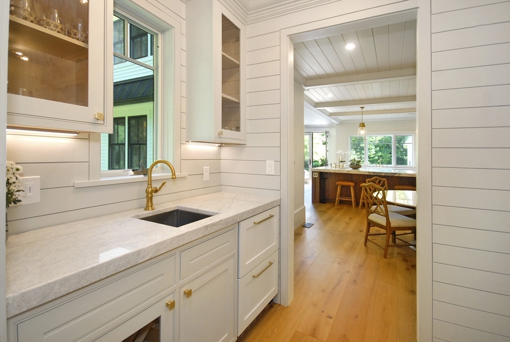 11 Williams Road Concord, MA 01742 - Photo 11 of 42 a kitchen with a sink and wooden floor