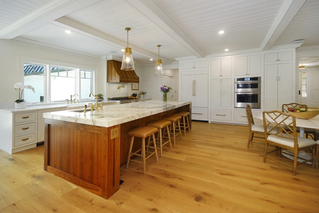 11 Williams Road Concord, MA 01742 - Photo 13 of 42 a large kitchen with kitchen island a sink table and chairs