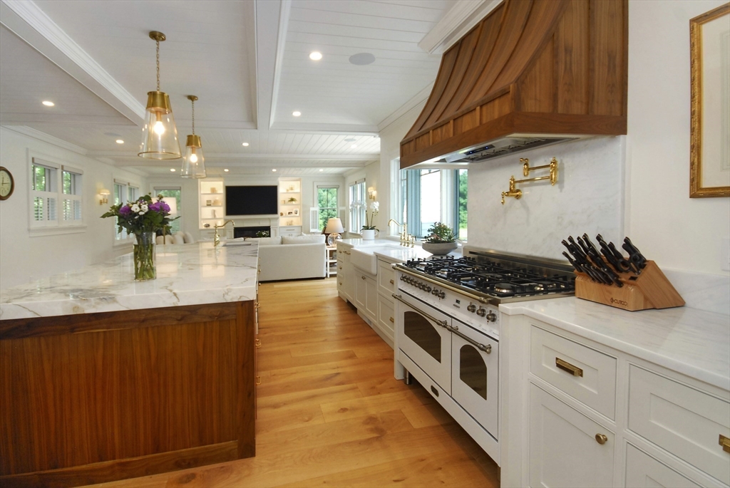 11 Williams Road Concord, MA 01742 - Photo 14 of 42 a kitchen with stainless steel appliances granite countertop a stove a sink and a microwave