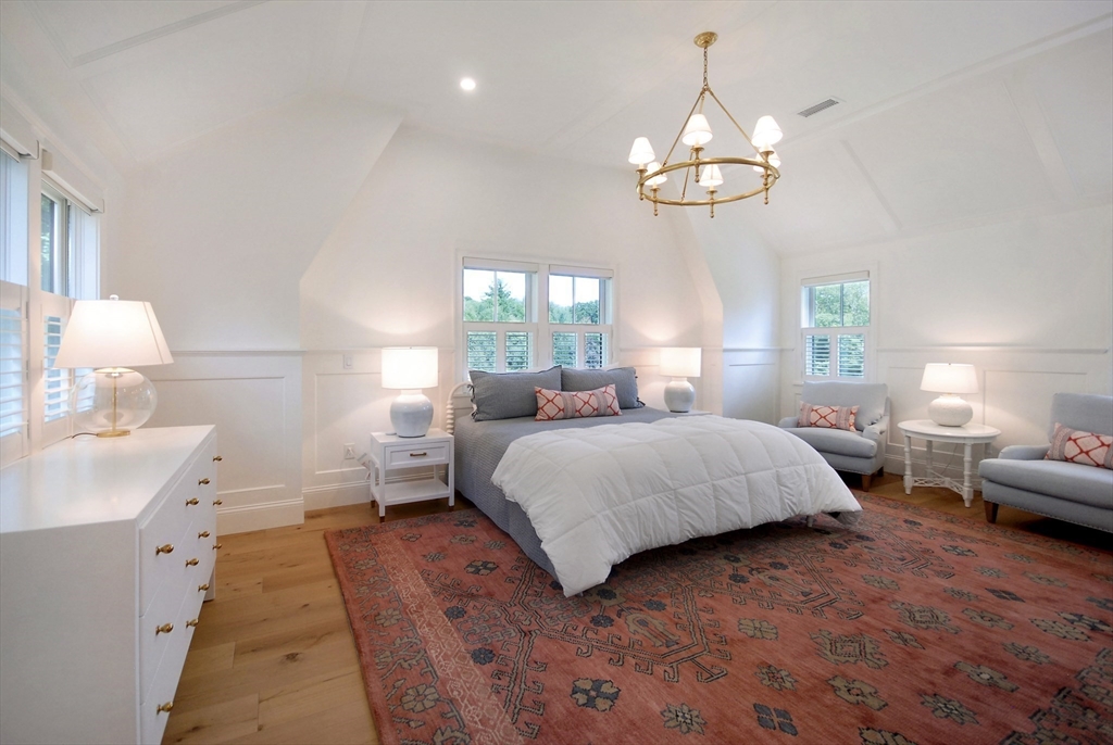 11 Williams Road Concord, MA 01742 - Photo 20 of 42 a bedroom with a bed chandelier and a window