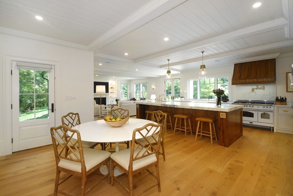 11 Williams Road Concord, MA 01742 - Photo 2 of 42 a kitchen with a table chairs stove and cabinets