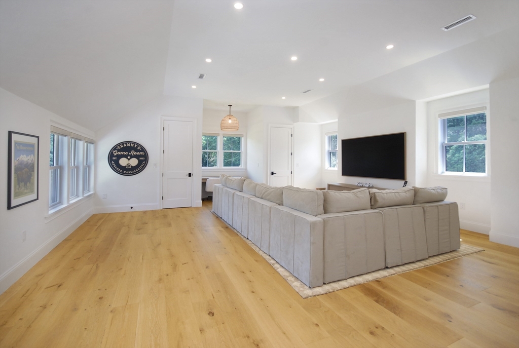 11 Williams Road Concord, MA 01742 - Photo 26 of 42 a living room with couches and a flat screen tv