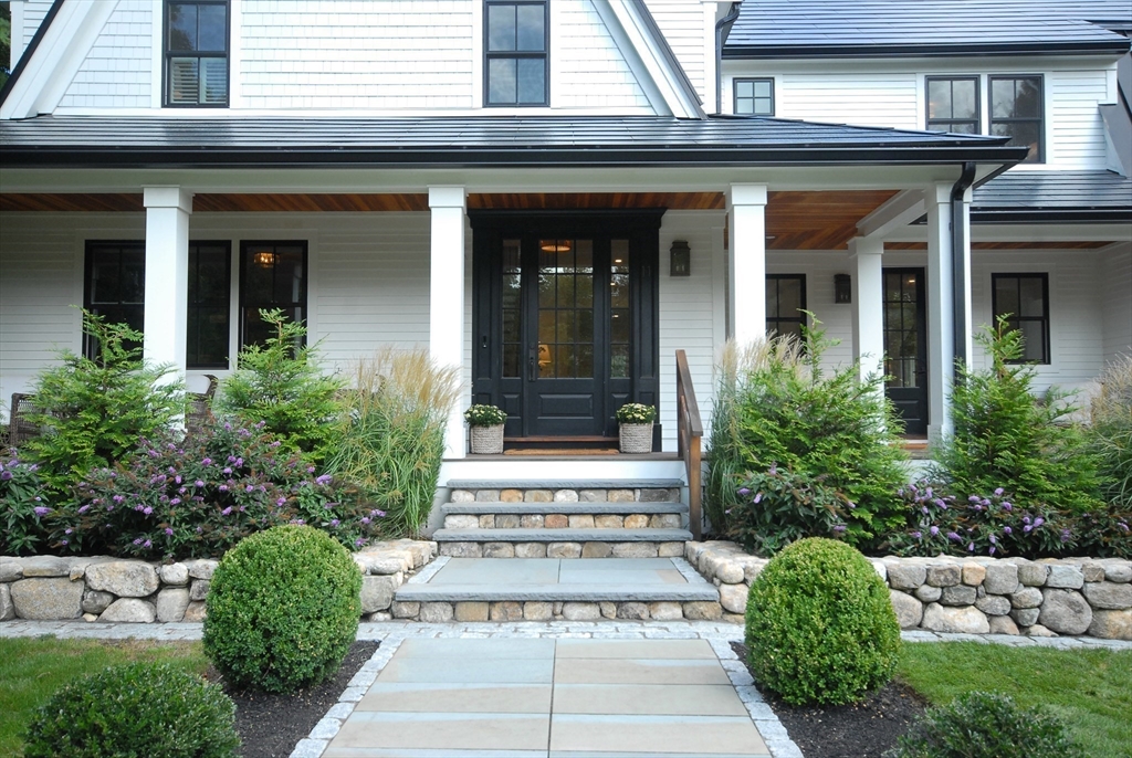 11 Williams Road Concord, MA 01742 - Photo 36 of 42 front view of a brick house with a large windows
