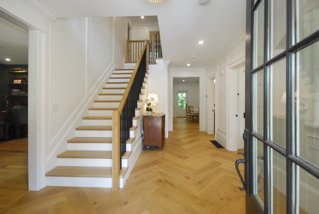 11 Williams Road Concord, MA 01742 - Photo 5 of 42 a view of a hallway with paintings on the walls
