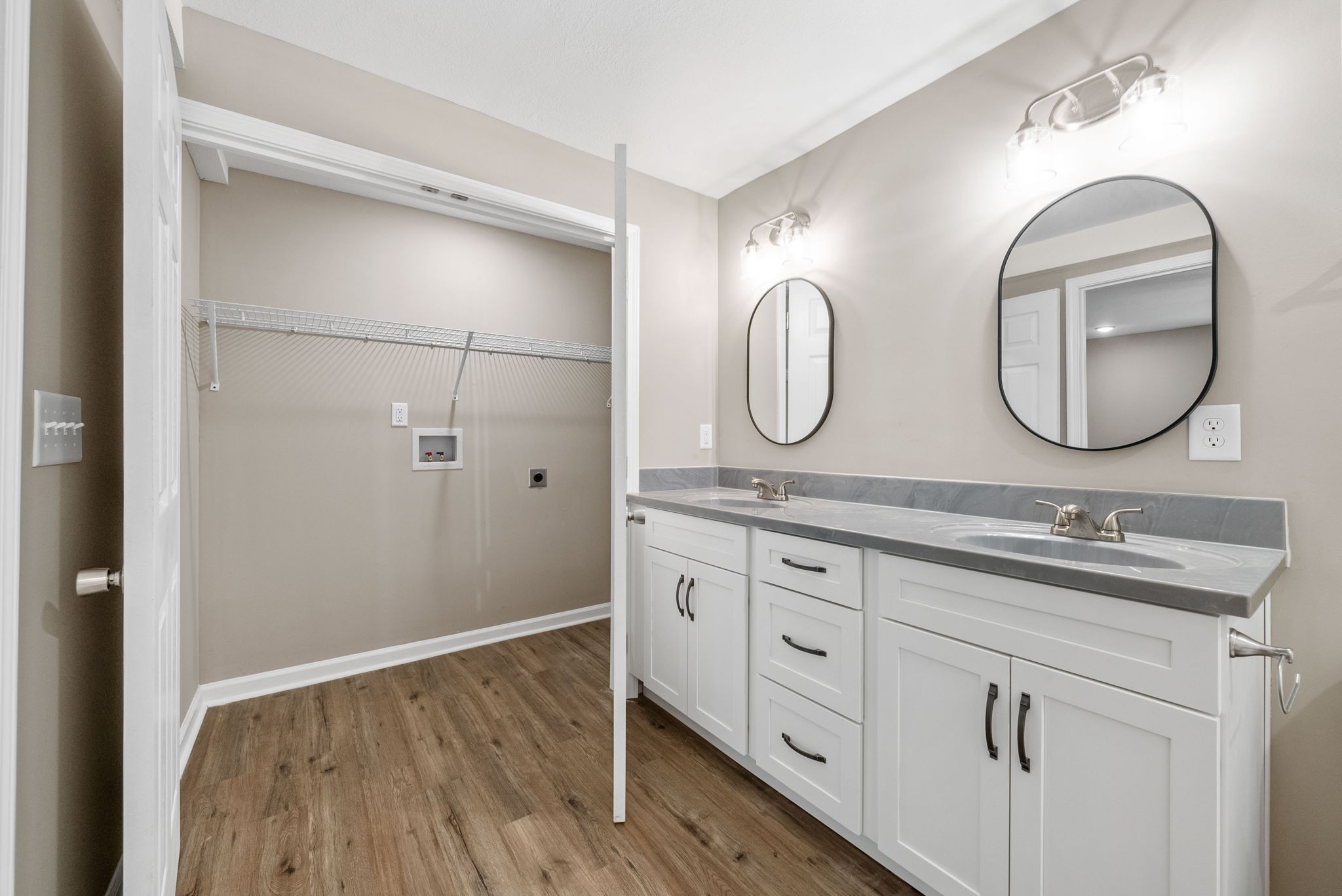 138 Walker Ridge Road Big Rock, TN 37023 - Photo 19 of 42 a bathroom with a double vanity sink and a mirror