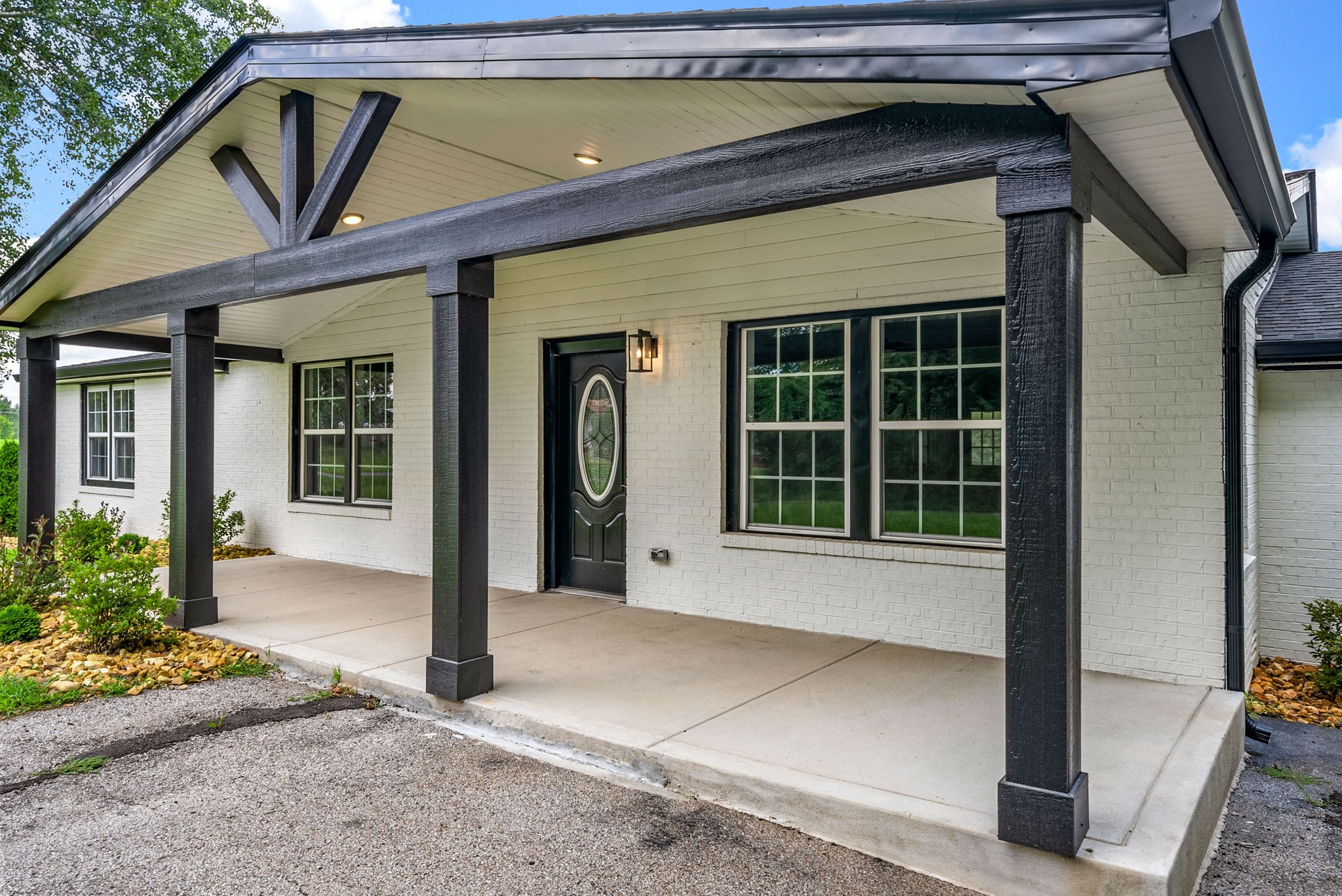 138 Walker Ridge Road Big Rock, TN 37023 - Photo 2 of 42 a front view of a house with a garden