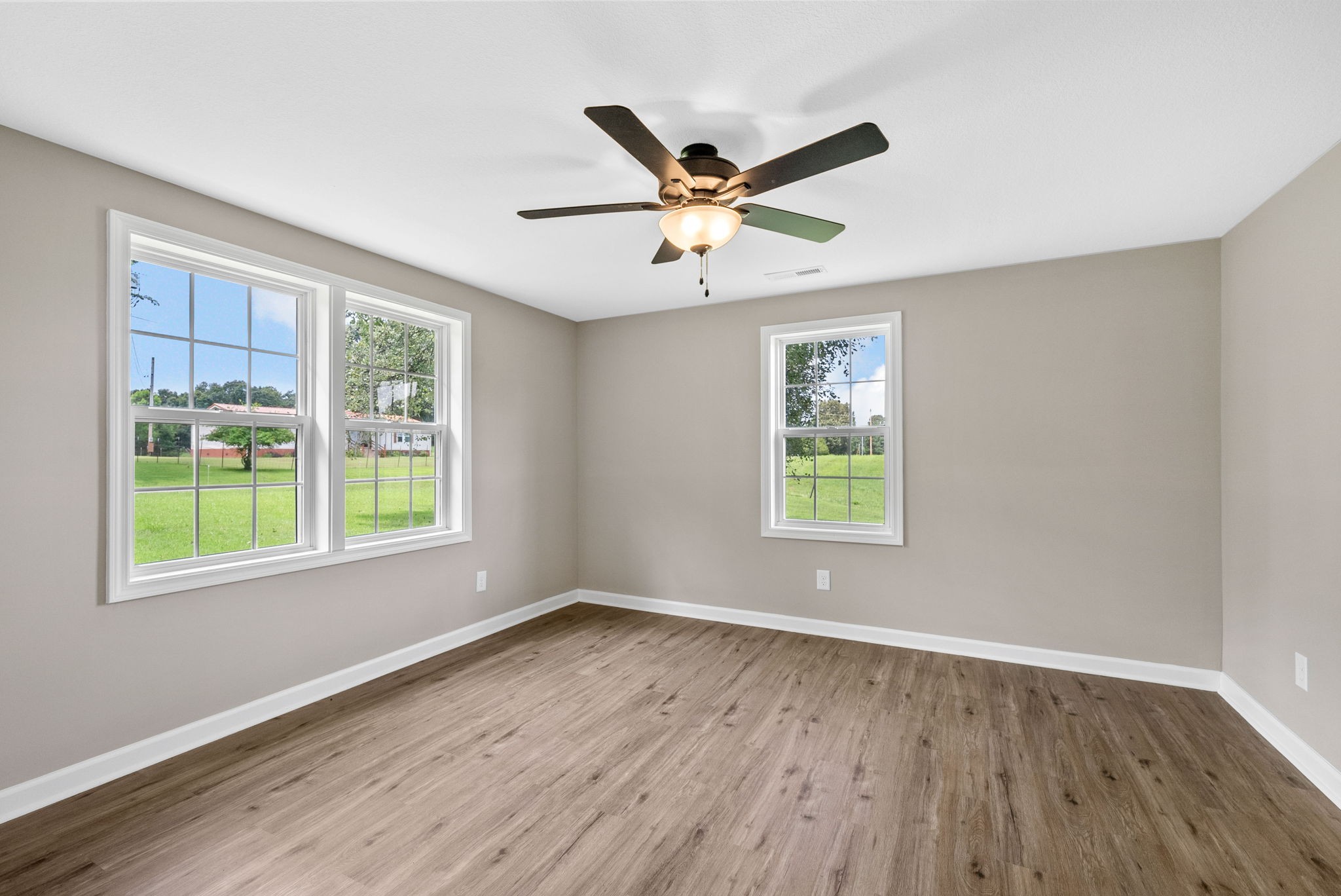 138 Walker Ridge Road Big Rock, TN 37023 - Photo 23 of 42 a view of an empty room with wooden floor and a window