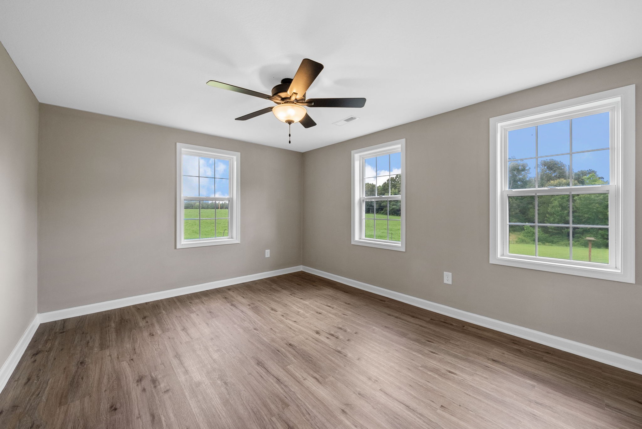 138 Walker Ridge Road Big Rock, TN 37023 - Photo 25 of 42 a view of an empty room with a window and wooden floor
