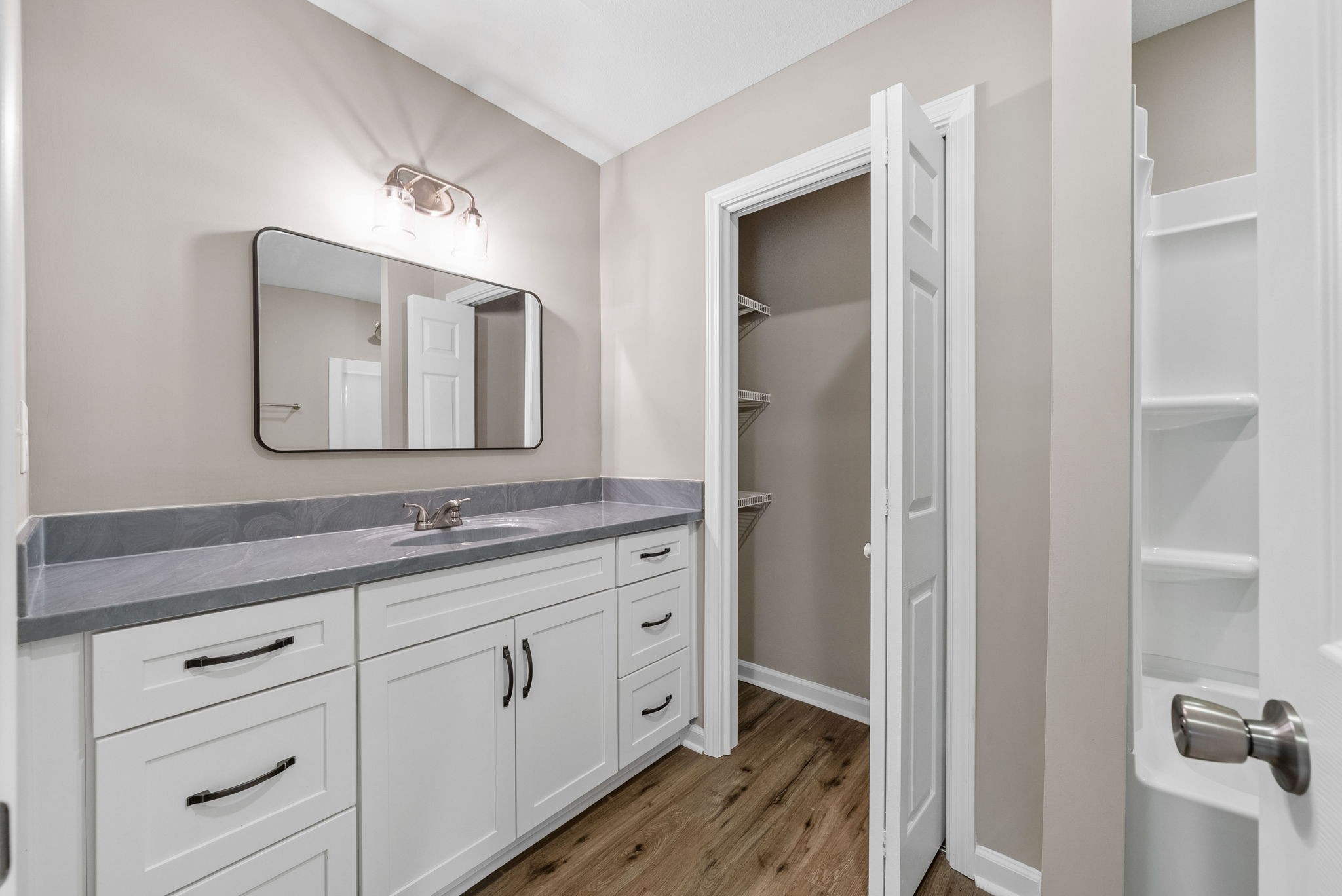 138 Walker Ridge Road Big Rock, TN 37023 - Photo 29 of 42 a bathroom with a double vanity sink and mirror