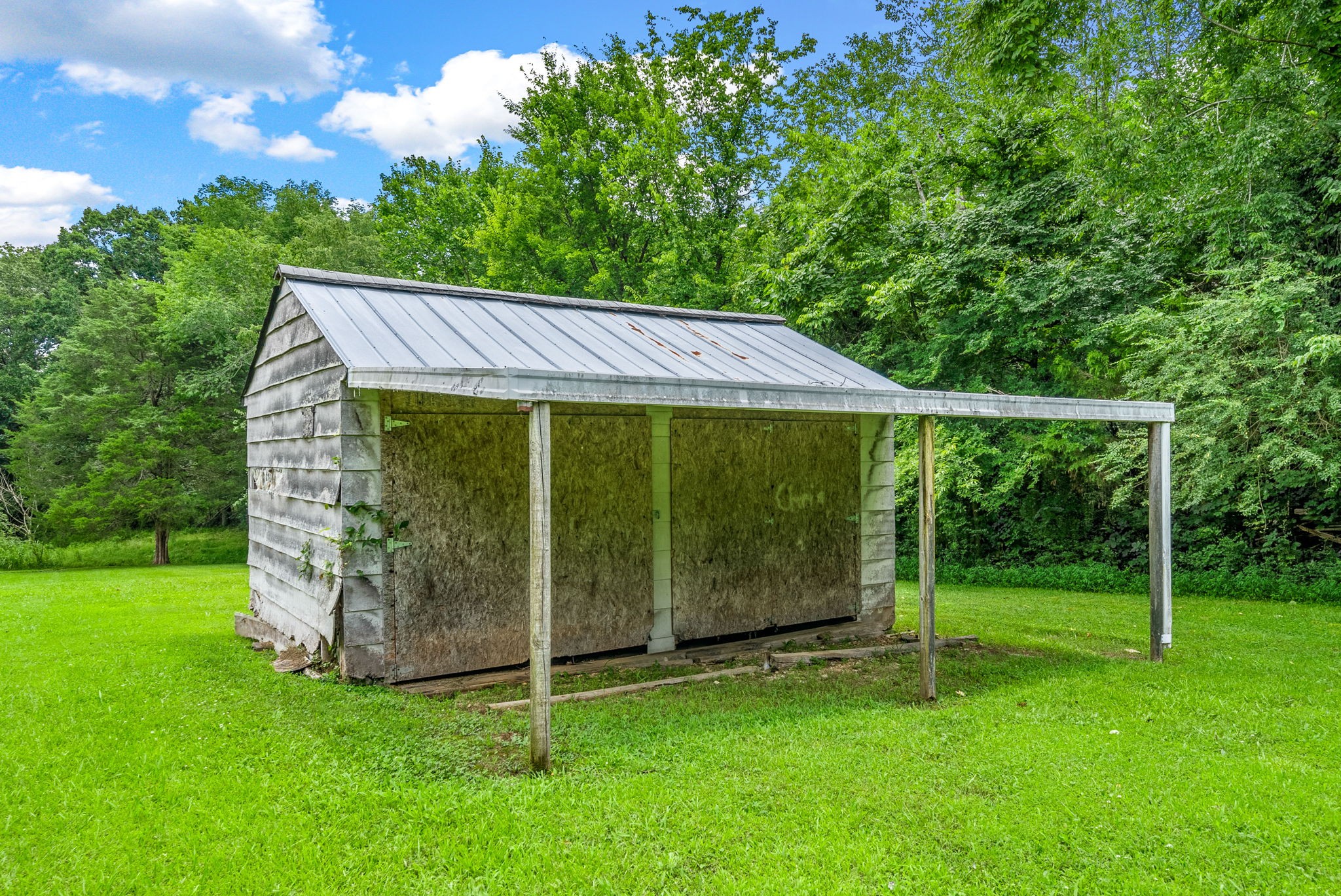 138 Walker Ridge Road Big Rock, TN 37023 - Photo 38 of 42 a view of a house with a backyard