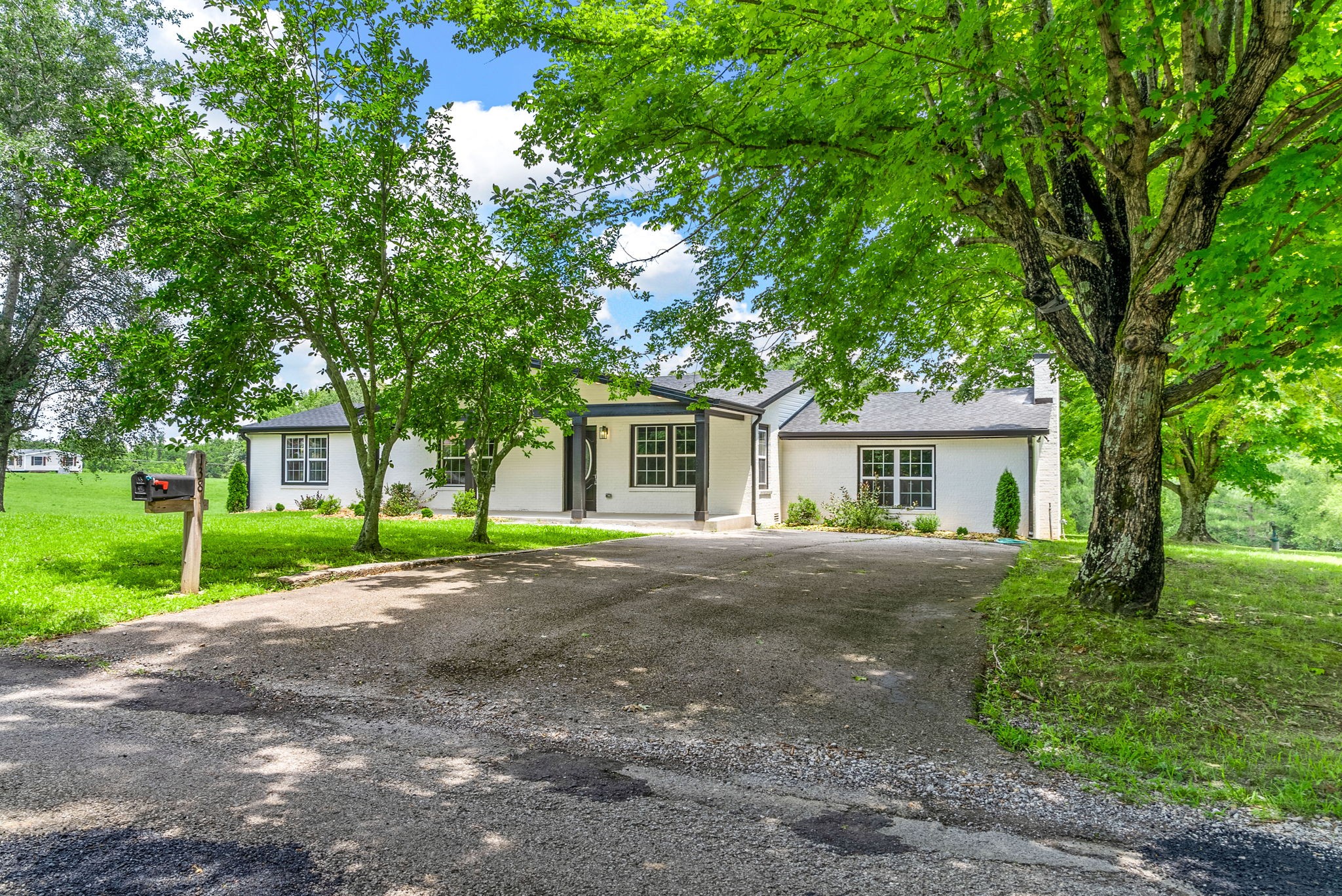 138 Walker Ridge Road Big Rock, TN 37023 - Photo 39 of 42 a front view of a house with a garden and trees