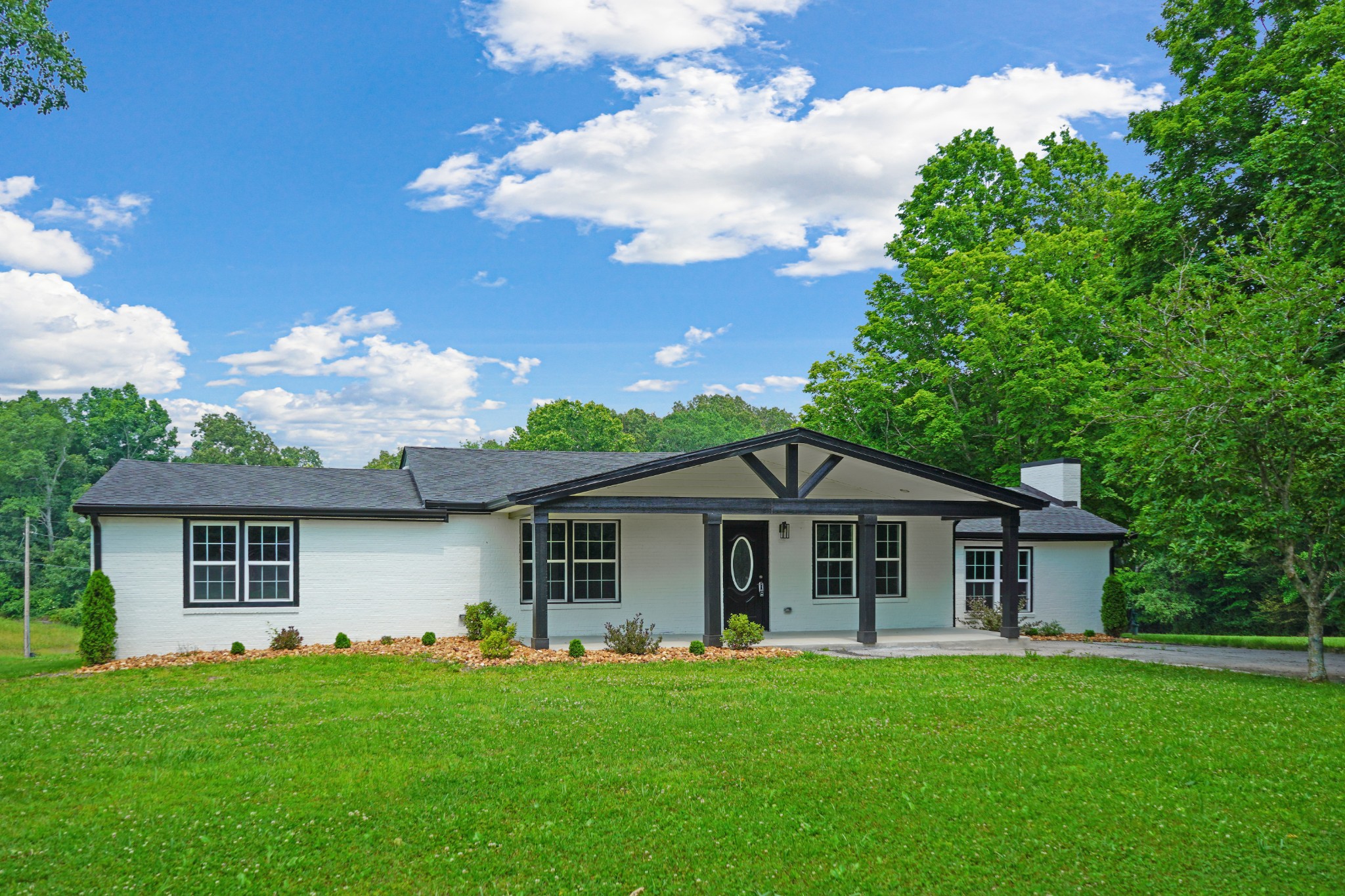 138 Walker Ridge Road Big Rock, TN 37023 - Photo 40 of 42 a front view of a house with a garden