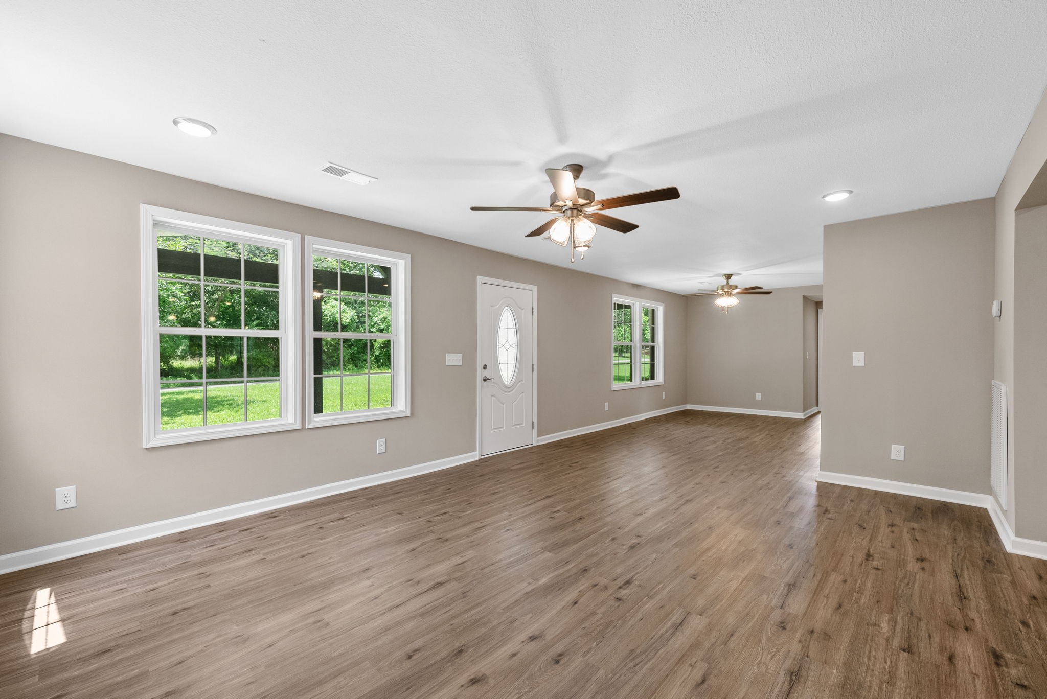 138 Walker Ridge Road Big Rock, TN 37023 - Photo 5 of 42 a view of an empty room with a window and wooden floor