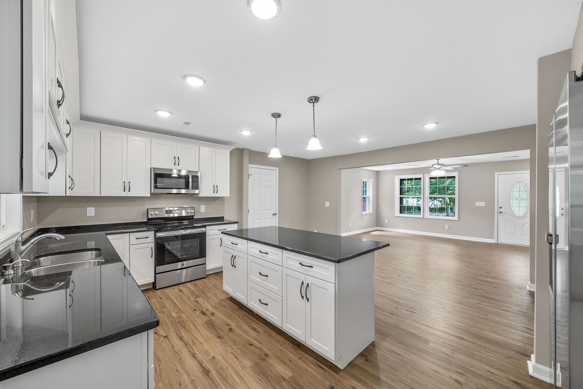 138 Walker Ridge Road Big Rock, TN 37023 - Photo 8 of 42 a kitchen with stainless steel appliances kitchen island granite countertop a stove a sink and a refrigerator