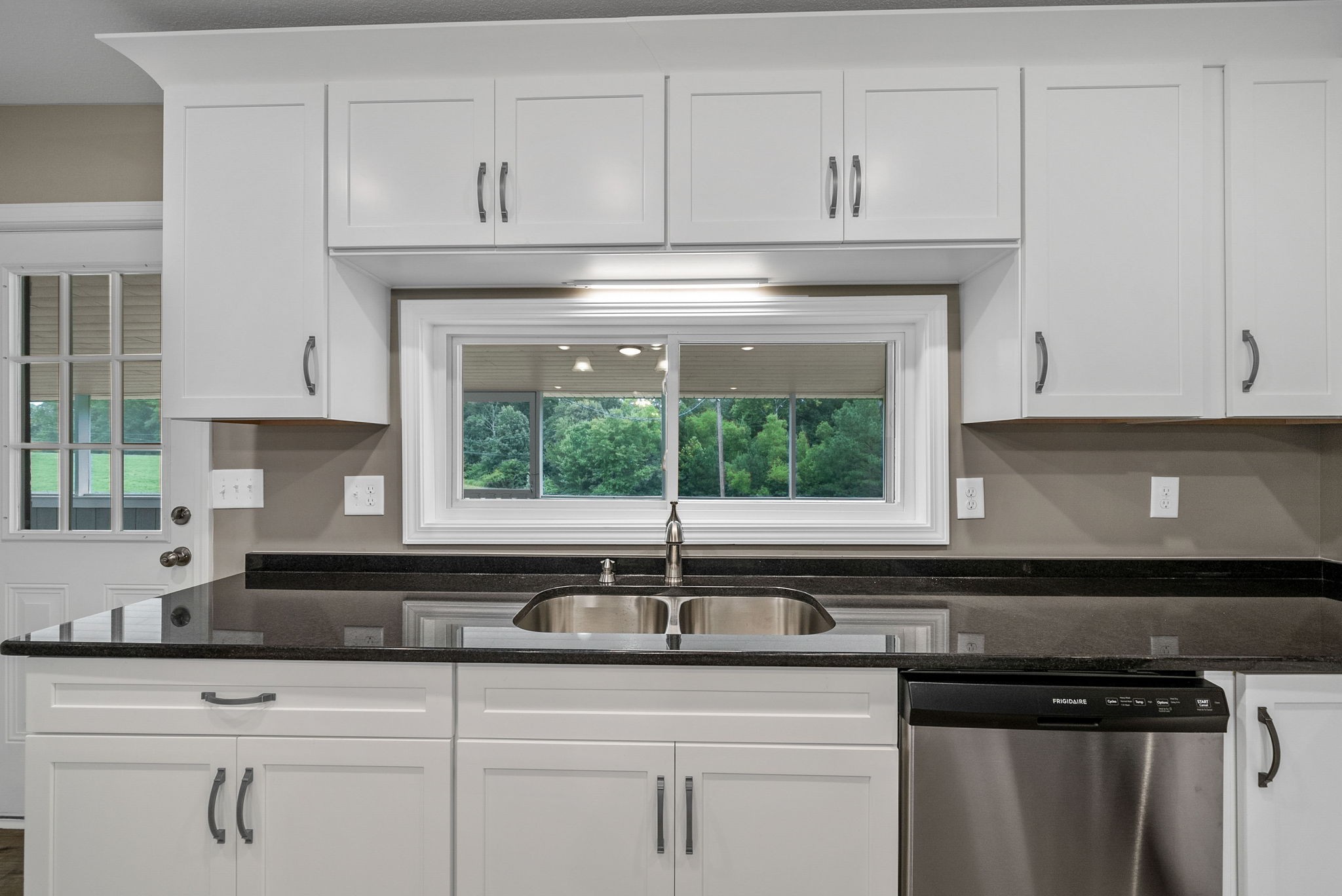 138 Walker Ridge Road Big Rock, TN 37023 - Photo 9 of 42 a kitchen with stainless steel appliances granite countertop white cabinets and a stove