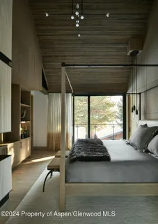 a bathroom with a glass shower door