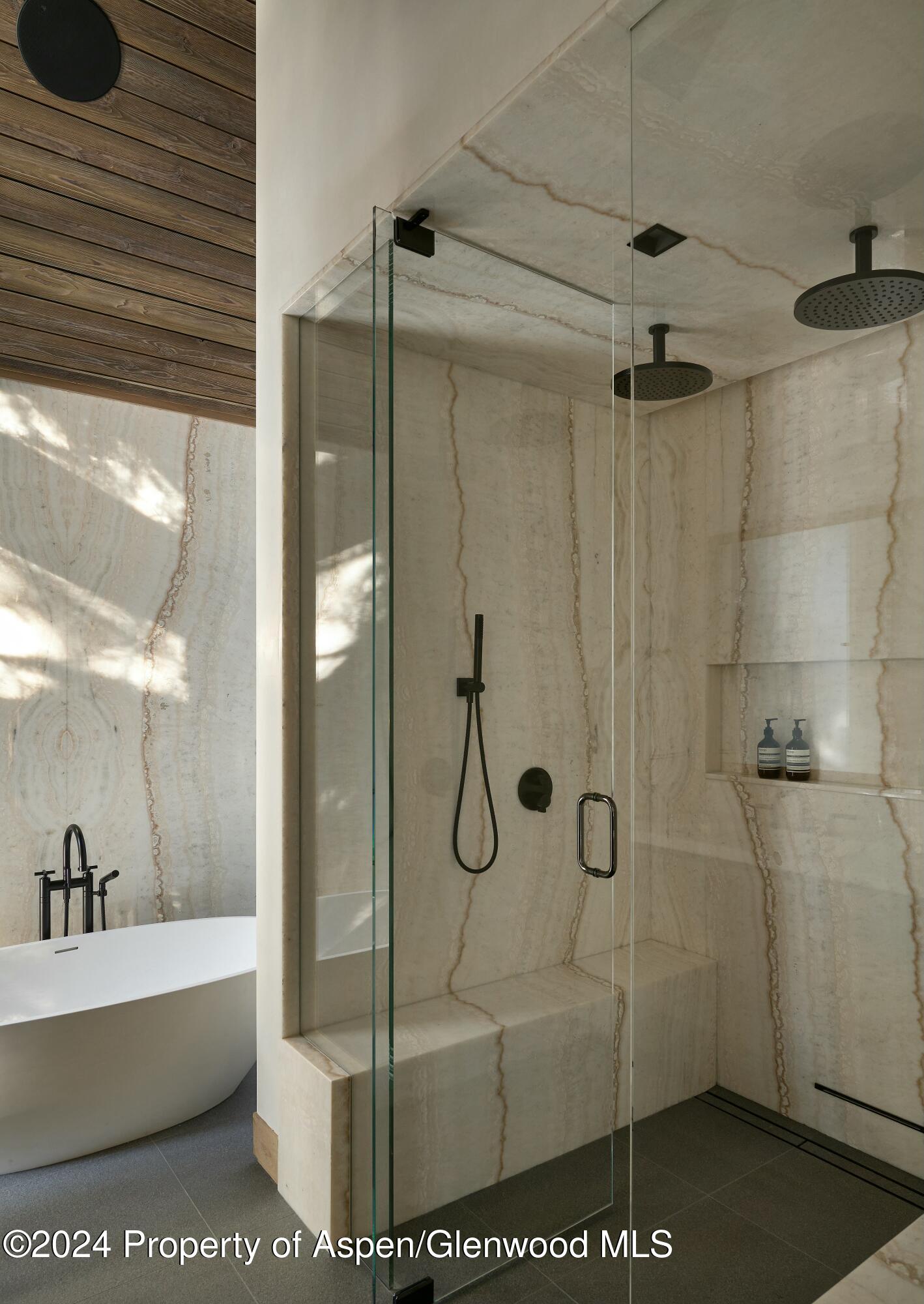 411 Pearl Court Aspen, CO 81611 - Photo 22 of 45 a bathroom with a glass shower door