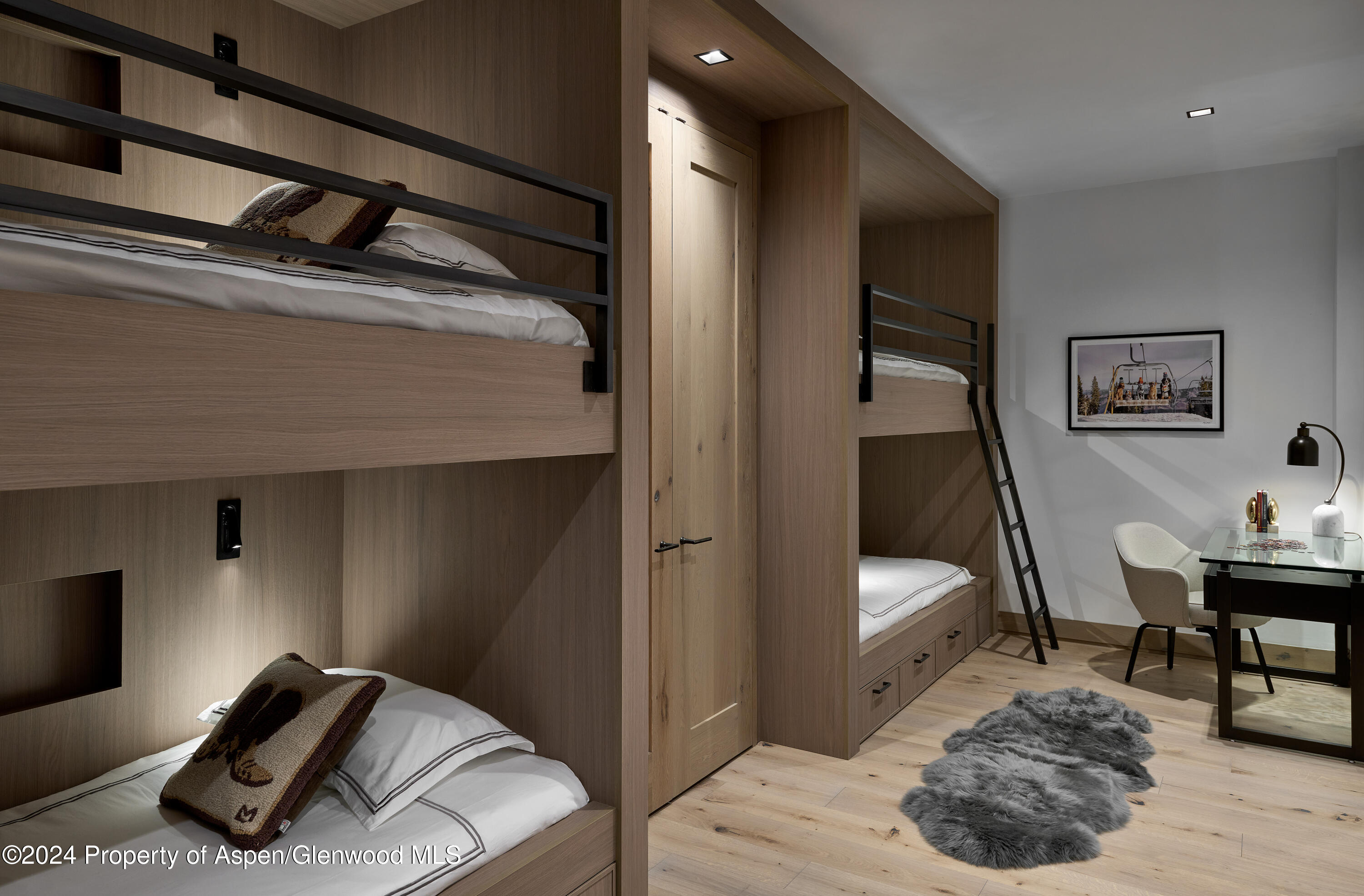 411 Pearl Court Aspen, CO 81611 - Photo 33 of 45 a bedroom with a bed and a chair