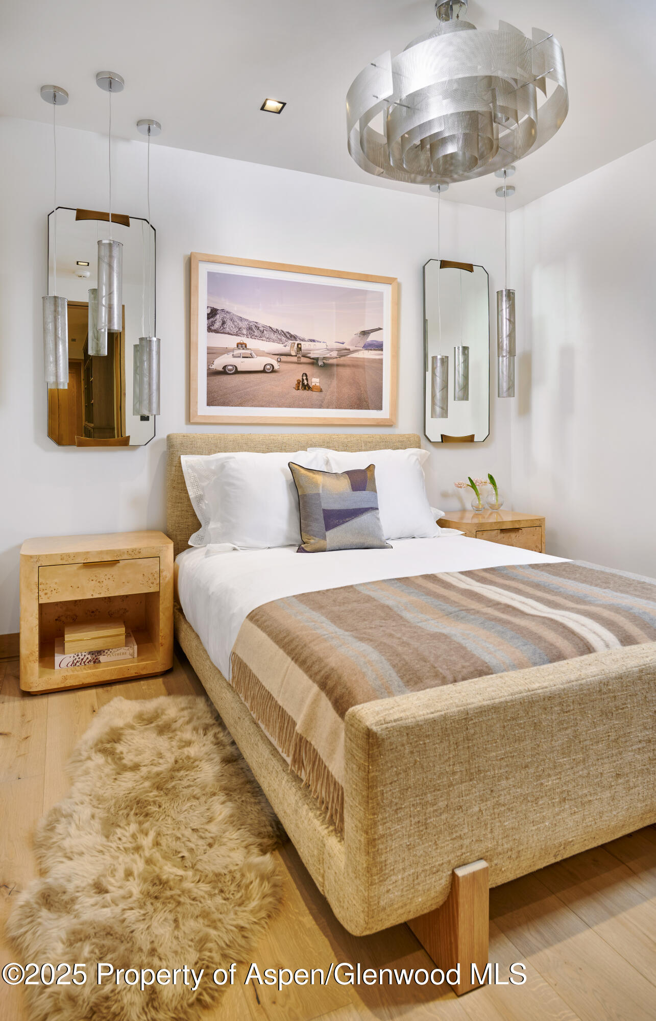 411 Pearl Court Aspen, CO 81611 - Photo 35 of 45 a bedroom with a bed and dresser