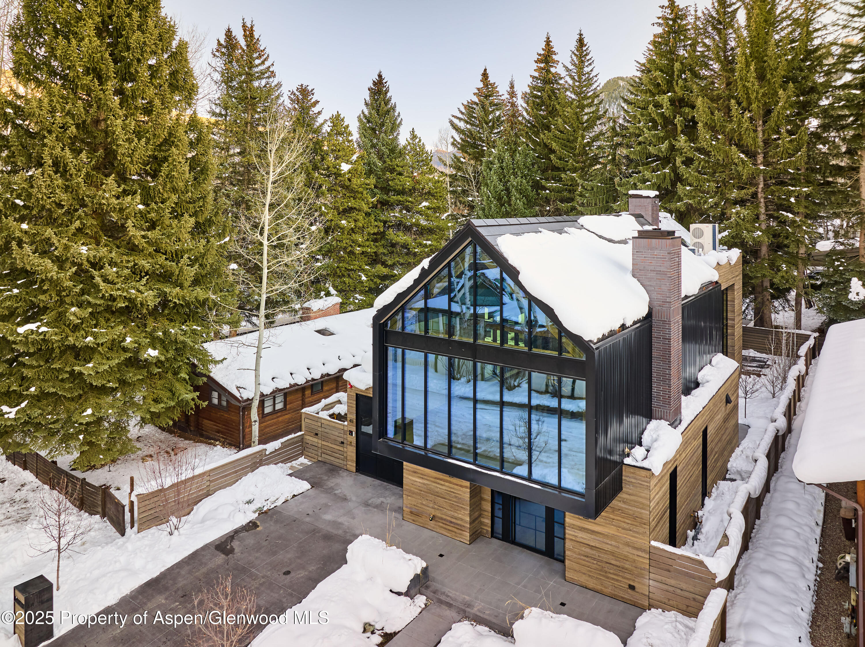 411 Pearl Court Aspen, CO 81611 - Photo 42 of 45 a view of a wooden house with a large windows
