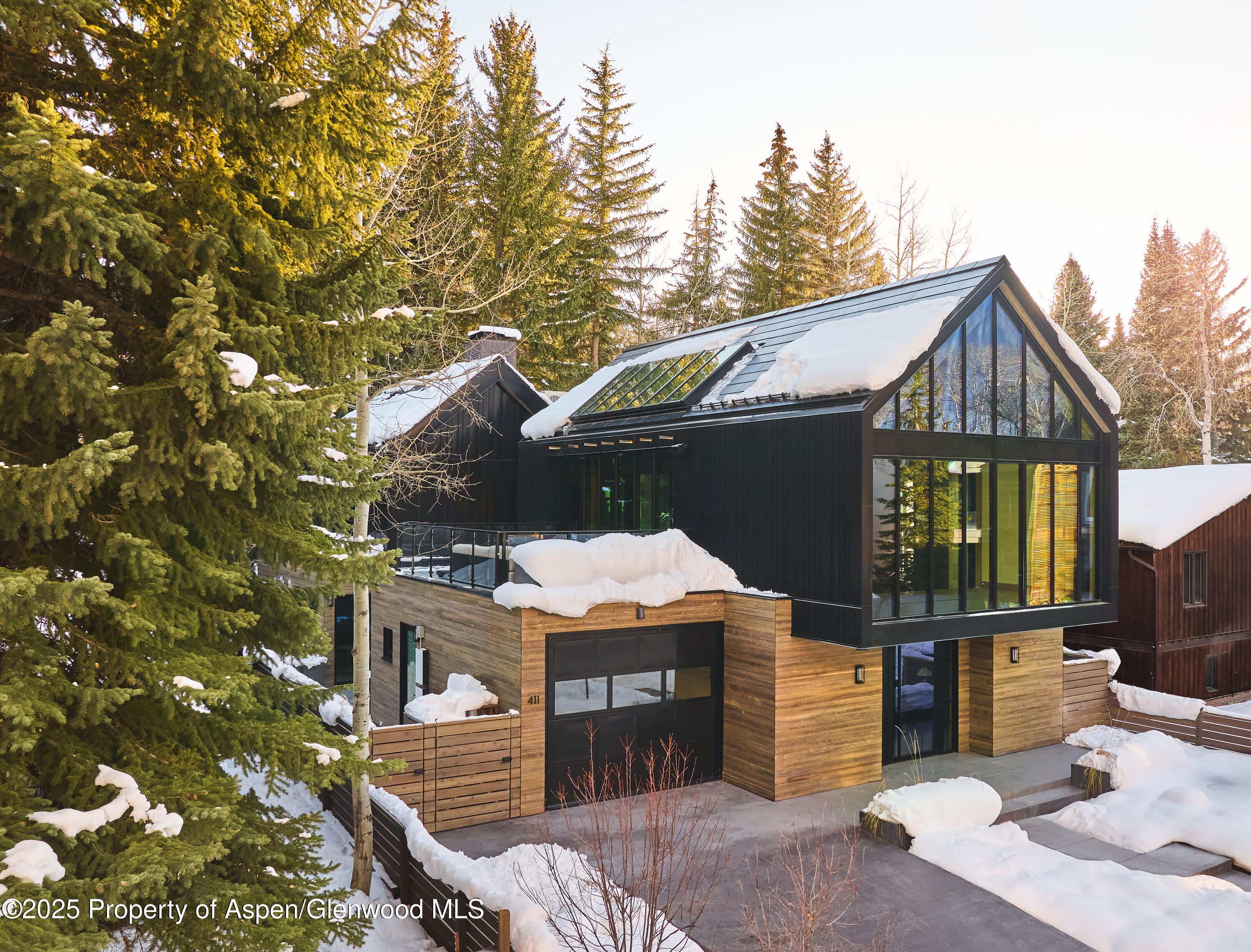 411 Pearl Court Aspen, CO 81611 - Photo 43 of 45 a front view of a house with a yard