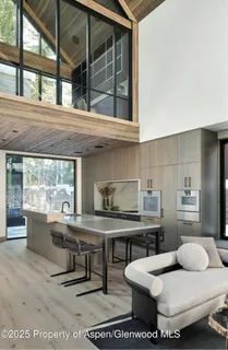 a kitchen with a sink and large window