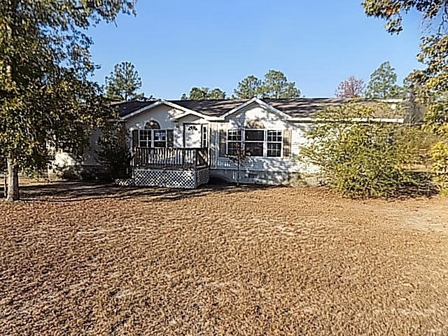 304 Tucker Road Lizella, GA 31052 - Photo 1 of 18 a front view of a house with a yard