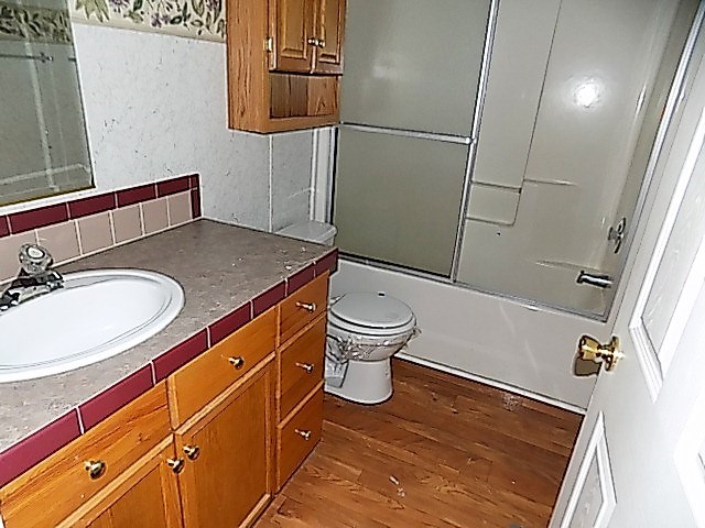 304 Tucker Road Lizella, GA 31052 - Photo 11 of 18 a bathroom with a sink a toilet a mirror and shower
