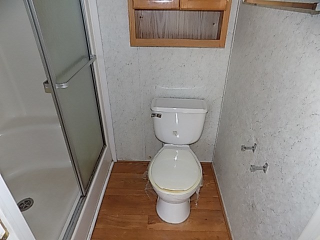 304 Tucker Road Lizella, GA 31052 - Photo 12 of 18 a bathroom with a toilet and a sink