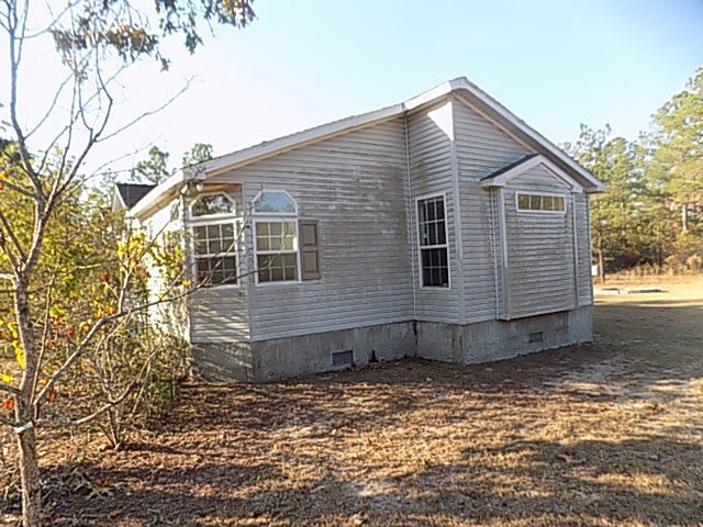304 Tucker Road Lizella, GA 31052 - Photo 15 of 18 a view of a house with a yard