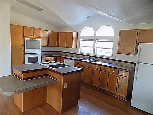 304 Tucker Road Lizella, GA 31052 - Photo 3 of 18 a kitchen with stainless steel appliances granite countertop a stove and a sink