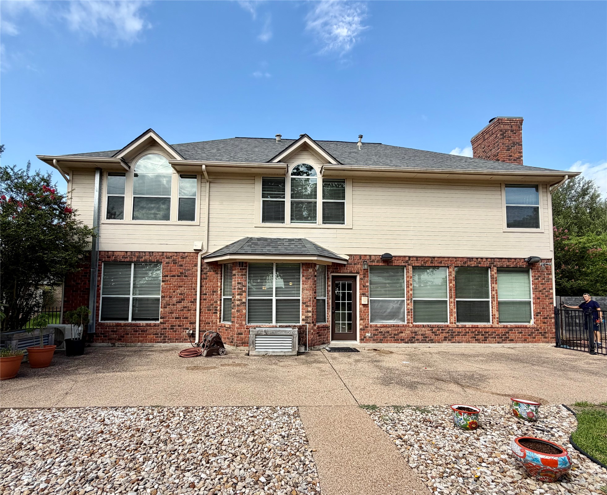 13 Oak View Round Rock, TX 78664 - Photo 29 of 30 A classic brick and siding two-story residence, featuring a broad patio for outdoor leisure.