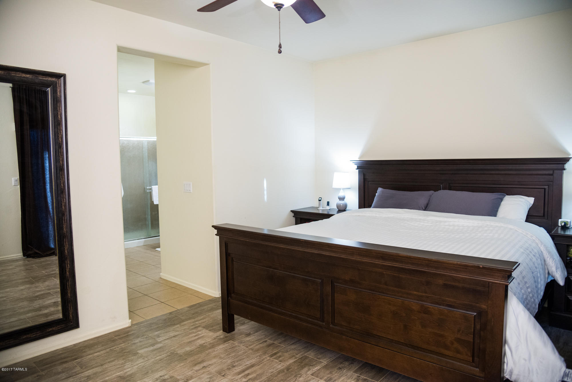 4405 West Crystal Ranch Place Marana, AZ 85658 - Photo 23 of 44 a bedroom with a bed and a table