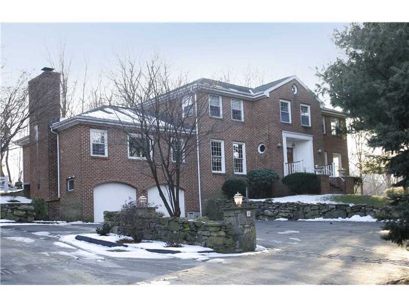4 Locust Hill Road Darien, CT 06820 - Photo 1 of 25 a front view of a house with garden
