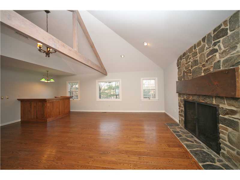 4 Locust Hill Road Darien, CT 06820 - Photo 11 of 25 a view of an empty room with a kitchen and a window