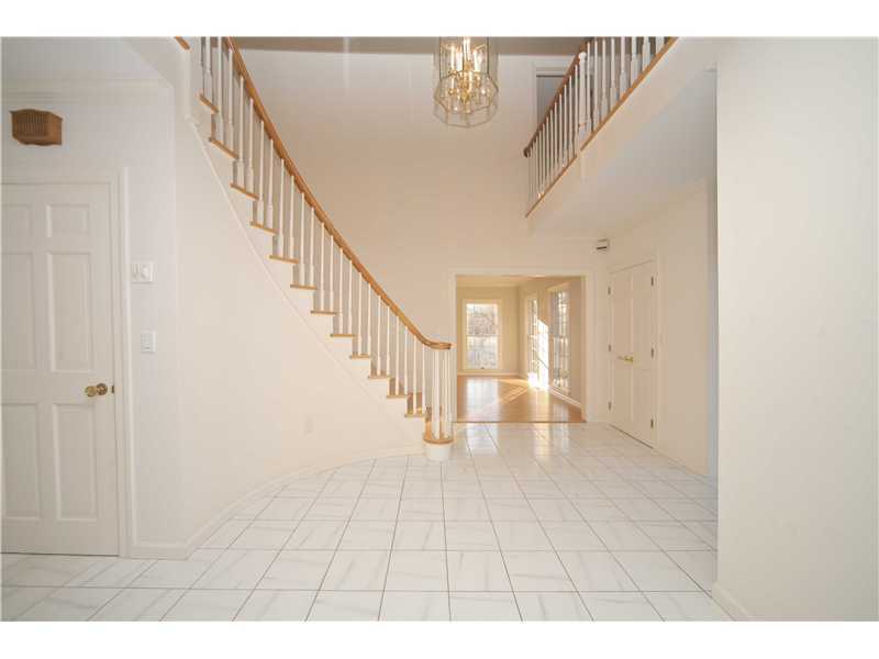 4 Locust Hill Road Darien, CT 06820 - Photo 2 of 25 a view of entryway with stairs