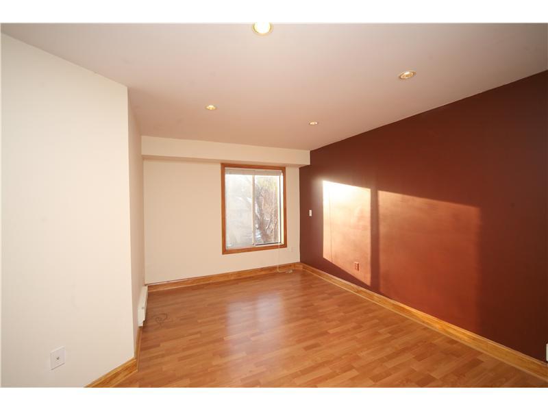 4 Locust Hill Road Darien, CT 06820 - Photo 22 of 25 a view of an empty room with wooden floor and a window