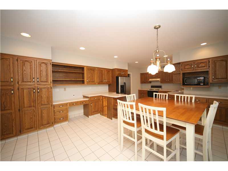 4 Locust Hill Road Darien, CT 06820 - Photo 9 of 25 a large kitchen with a table and chairs