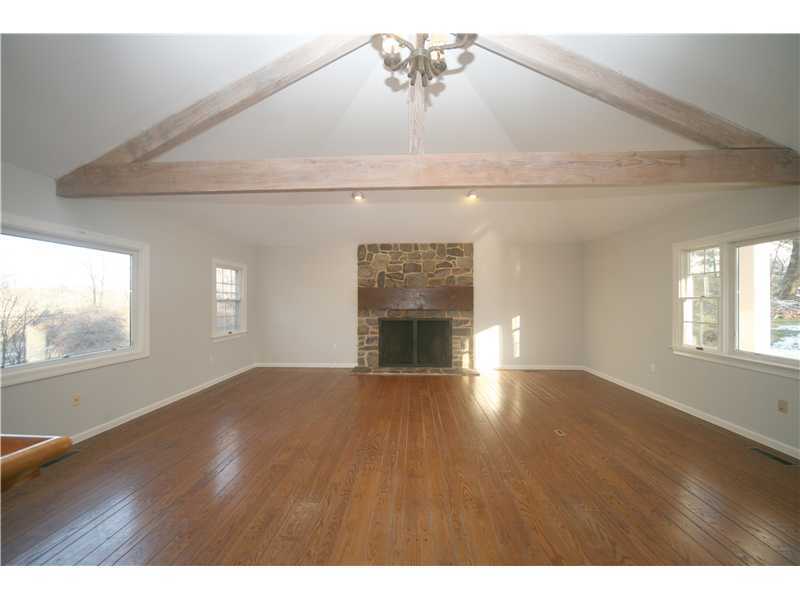 4 Locust Hill Road Darien, CT 06820 - Photo 10 of 25 a view of empty room with wooden floor and fan