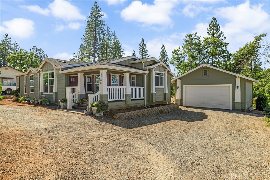 2208 De Mille Road Paradise, CA 95969 - Photo 1 of 1 a front view of a house with a yard and garage