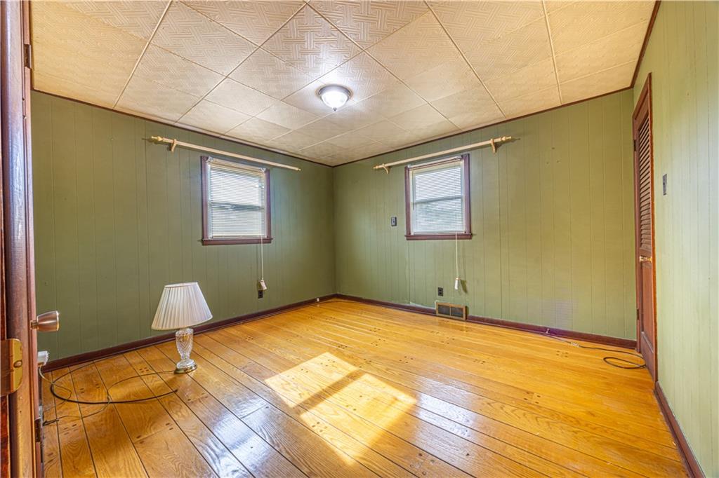 82 East Kerr Street Uniontown, PA 15401 - Photo 12 of 18 a view of a room with wooden floor and windows