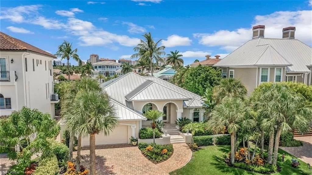 452 Willet Avenue Naples, FL 34108 - Photo 24 of 28 a front view of a house with garden