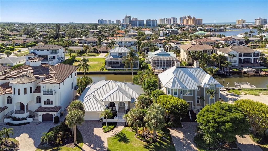 452 Willet Avenue Naples, FL 34108 - Photo 25 of 28 an aerial view of residential houses with outdoor space and swimming pool