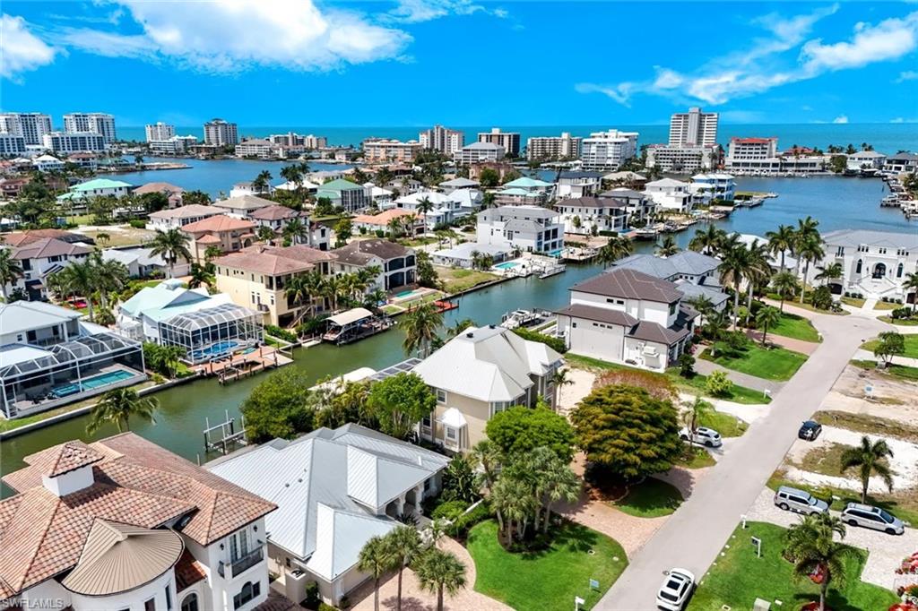 452 Willet Avenue Naples, FL 34108 - Photo 27 of 28 an aerial view of residential houses with outdoor space
