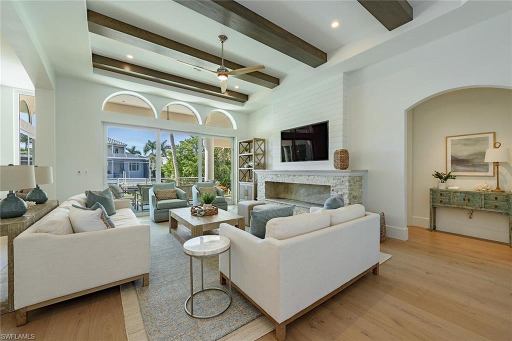 452 Willet Avenue Naples, FL 34108 - Photo 5 of 28 a living room with furniture and a flat screen tv